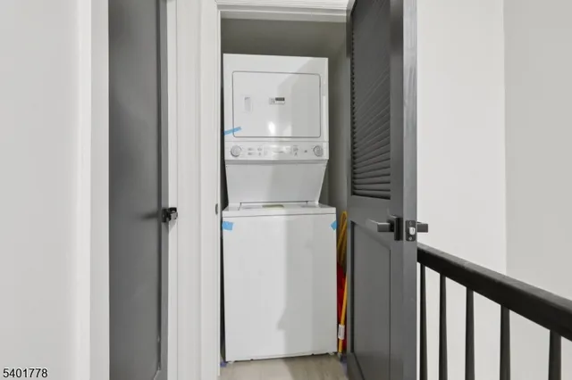 a view of storage and utility room with washer and dryer
