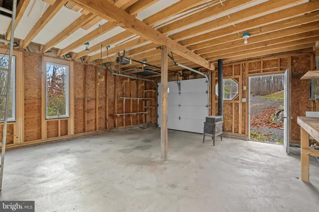 a view of empty room with wooden walls