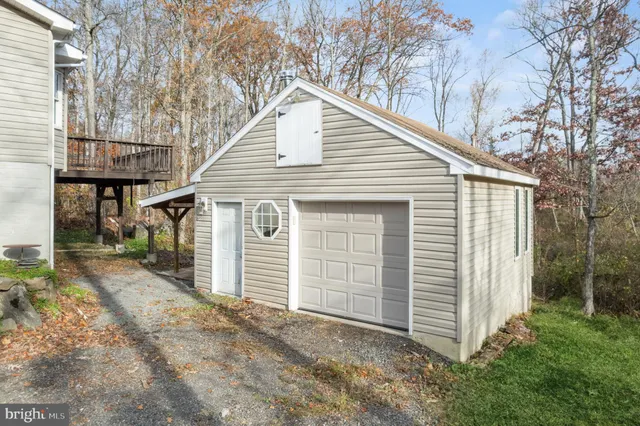 a view of a house with a yard and garage