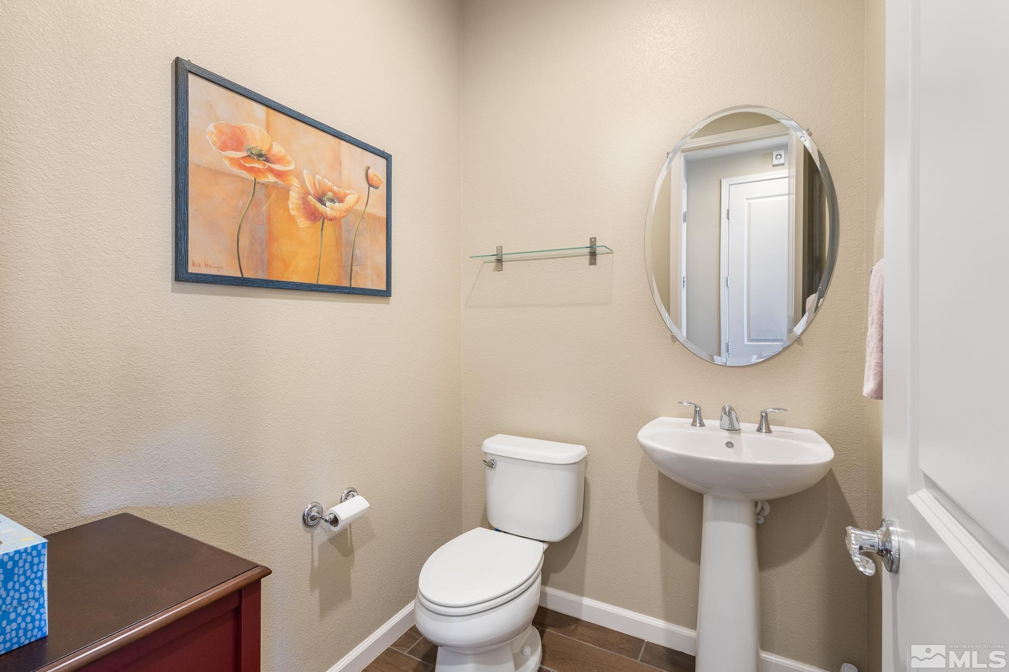 2875 Bonfire Lane Reno, NV 89521 - Photo 11 of 39 a bathroom with a toilet sink and mirror