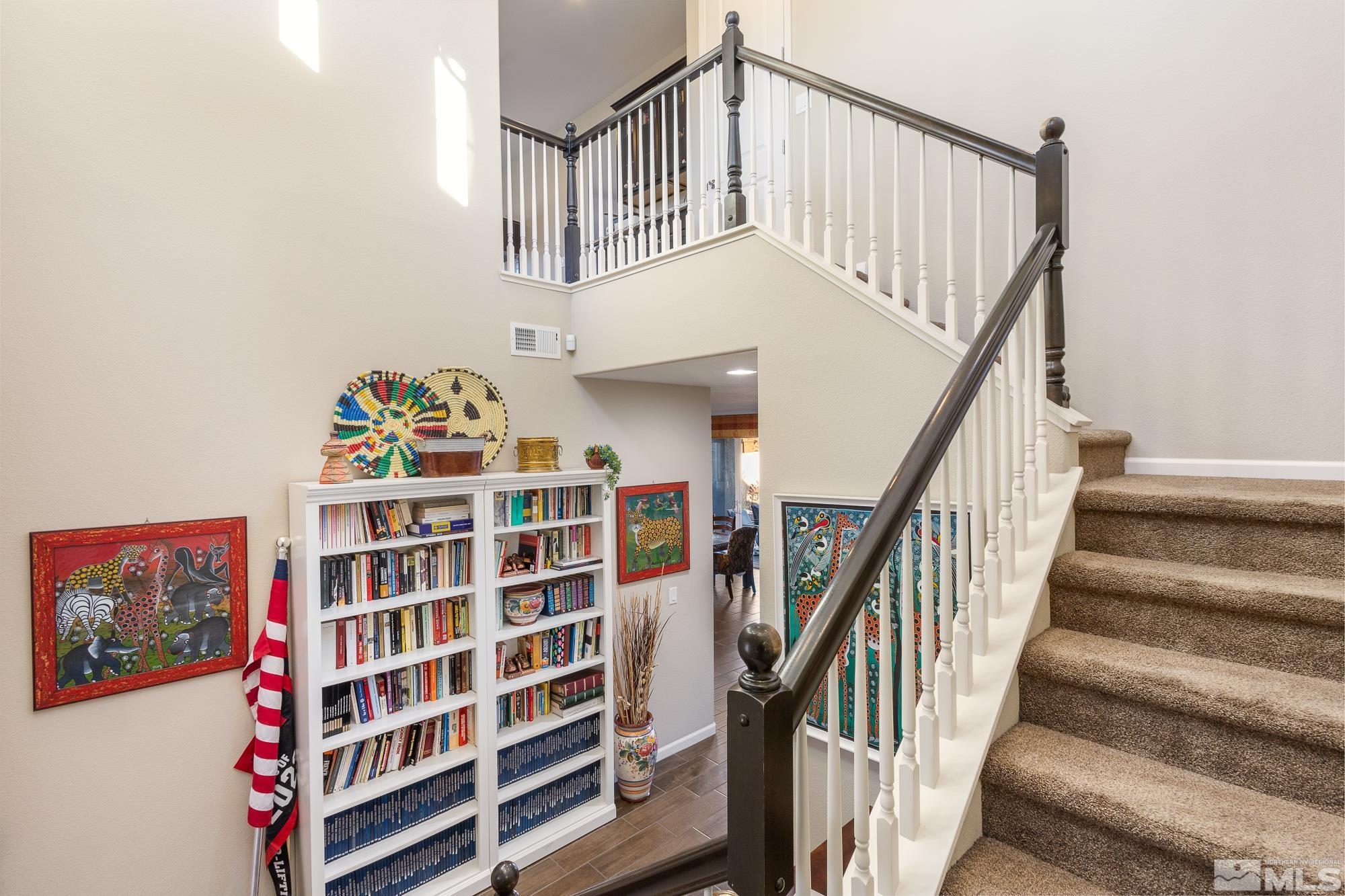 2875 Bonfire Lane Reno, NV 89521 - Photo 13 of 39 a view of staircase with wooden floor and white walls