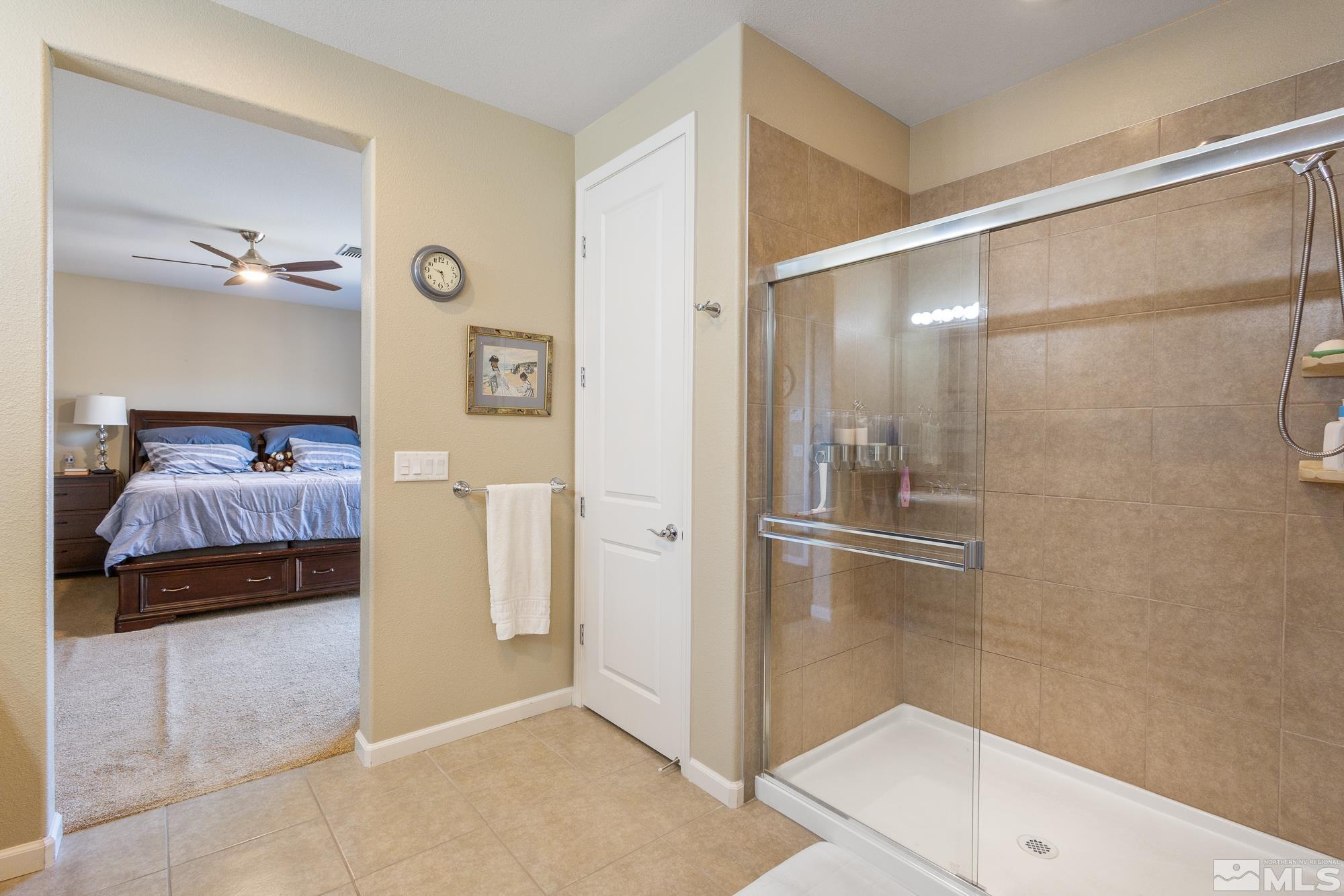 2875 Bonfire Lane Reno, NV 89521 - Photo 19 of 39 a bathroom with a shower and a sink