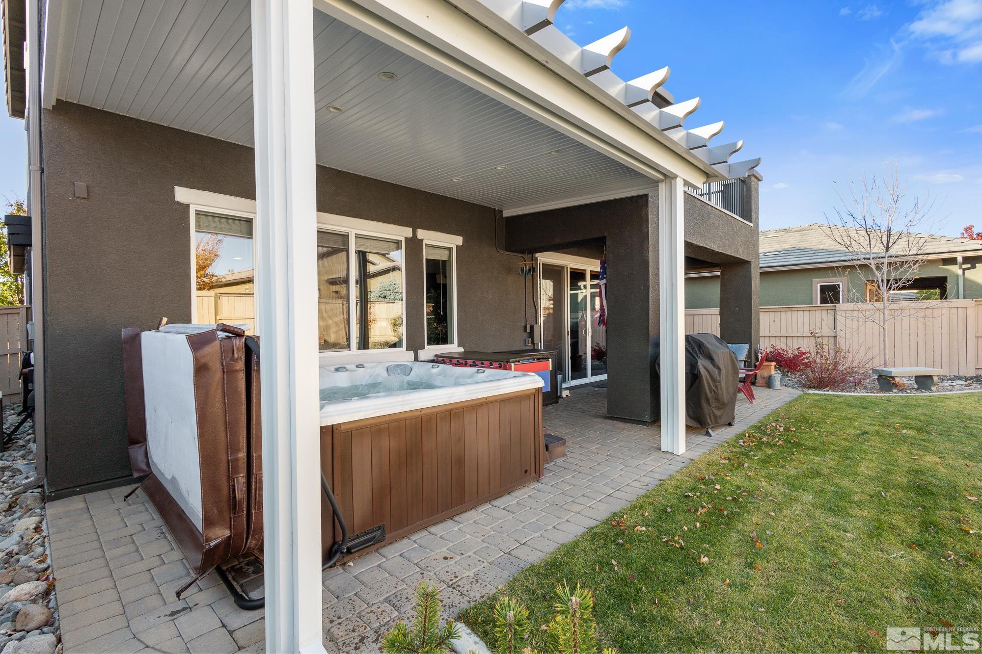 2875 Bonfire Lane Reno, NV 89521 - Photo 28 of 39 a view of living room kitchen with stainless steel appliances granite countertop cabinets and outdoor view
