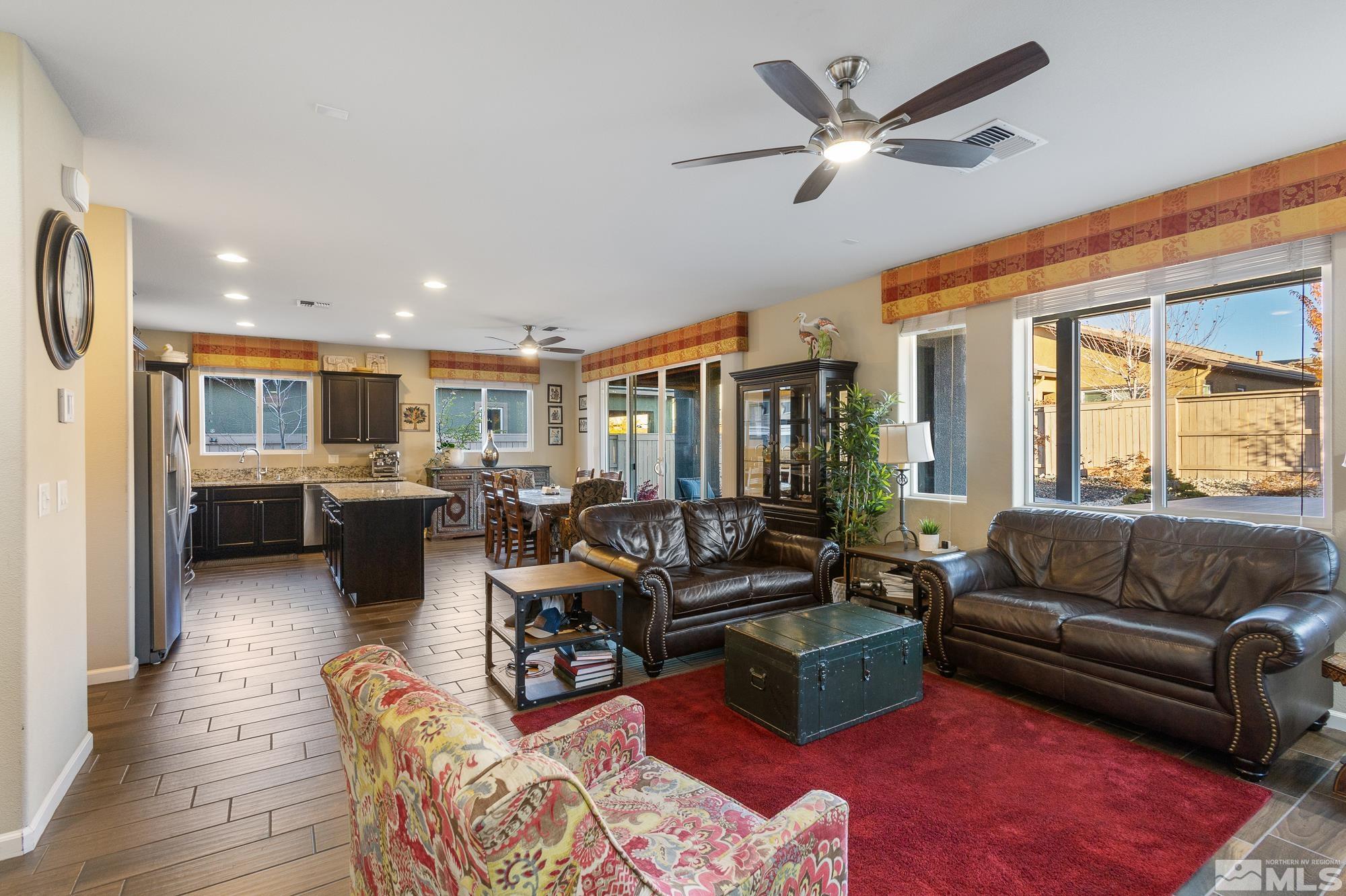 2875 Bonfire Lane Reno, NV 89521 - Photo 5 of 39 a living room with furniture ceiling fan and a rug