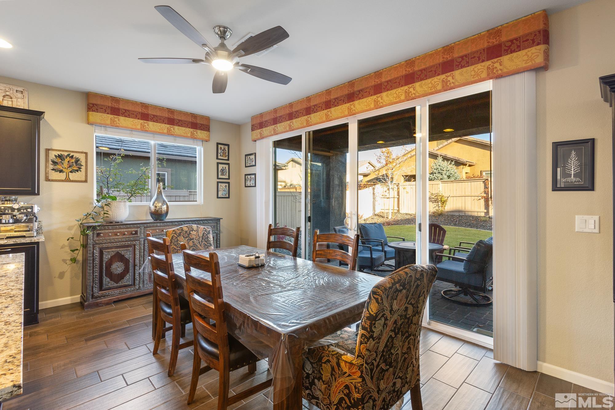 2875 Bonfire Lane Reno, NV 89521 - Photo 9 of 39 a view of a dining room with furniture window and wooden floor