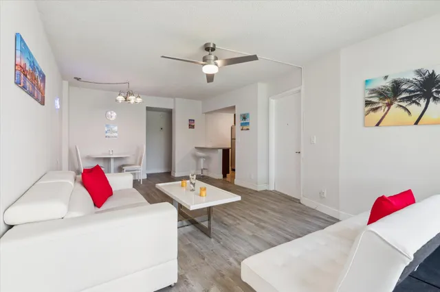 a living room with furniture and a table