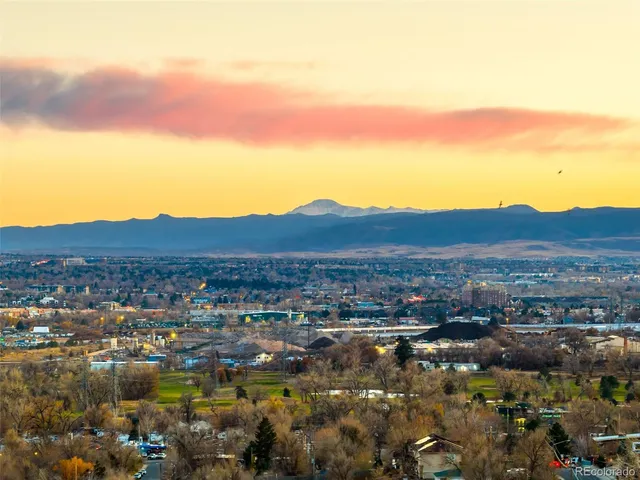 a view of a city with mountains in the background