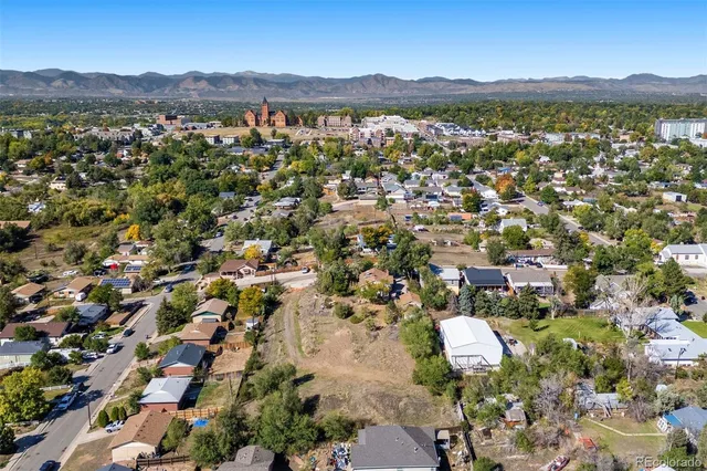 an aerial view of residential house with outdoor space and mountain view
