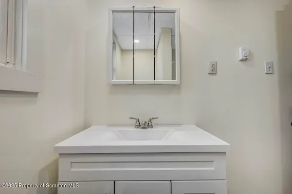 a bathroom with a sink and a vanity
