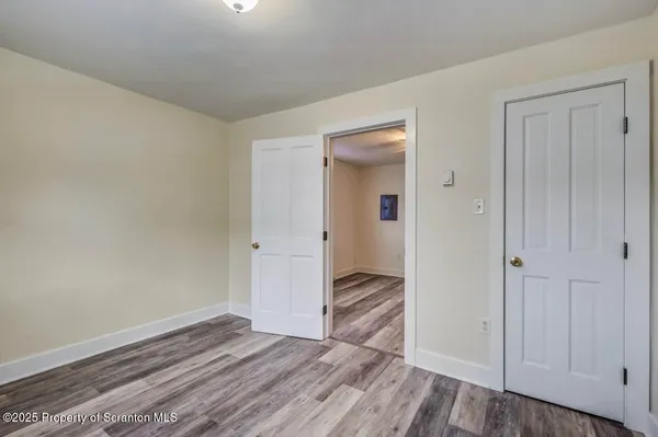a view of a livingroom with wooden floor