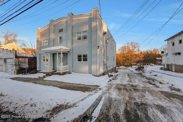 a view of a street with big house