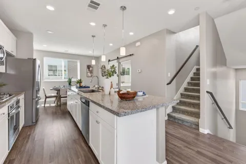 a bedroom with a bed and bathroom