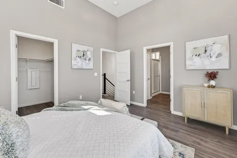 a bedroom with bed and a window