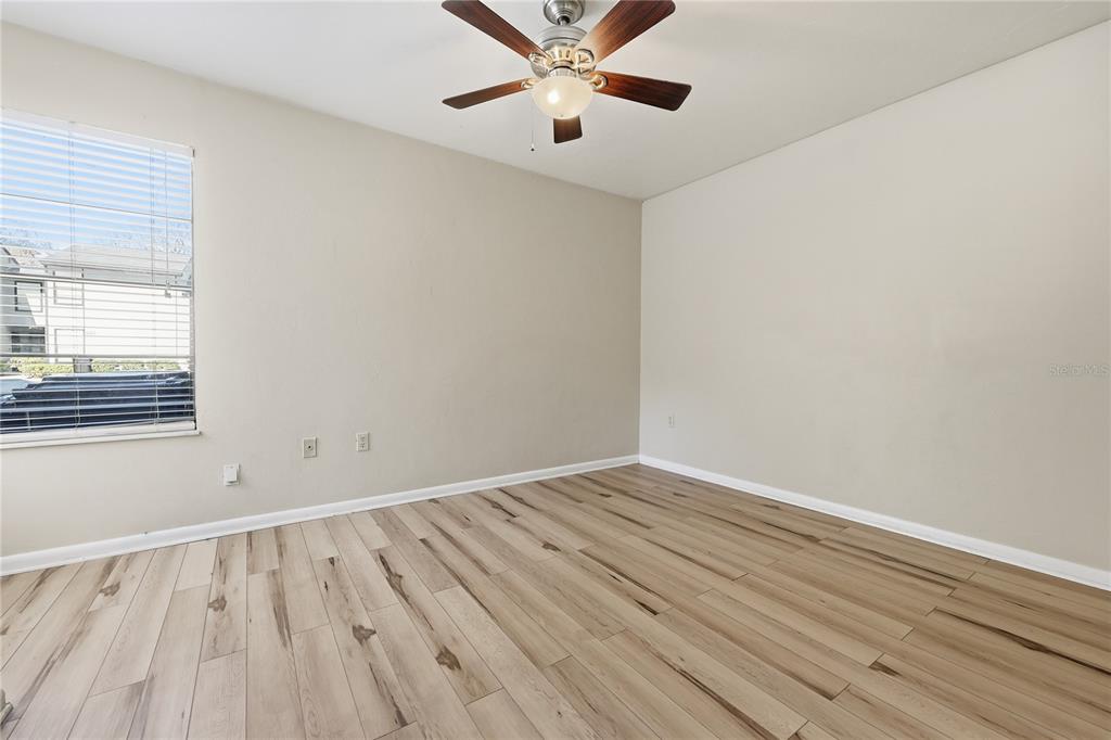 4427 Southwest 21st Lane Gainesville, FL 32607 - Photo 20 of 36 wooden floor in an empty room with a window