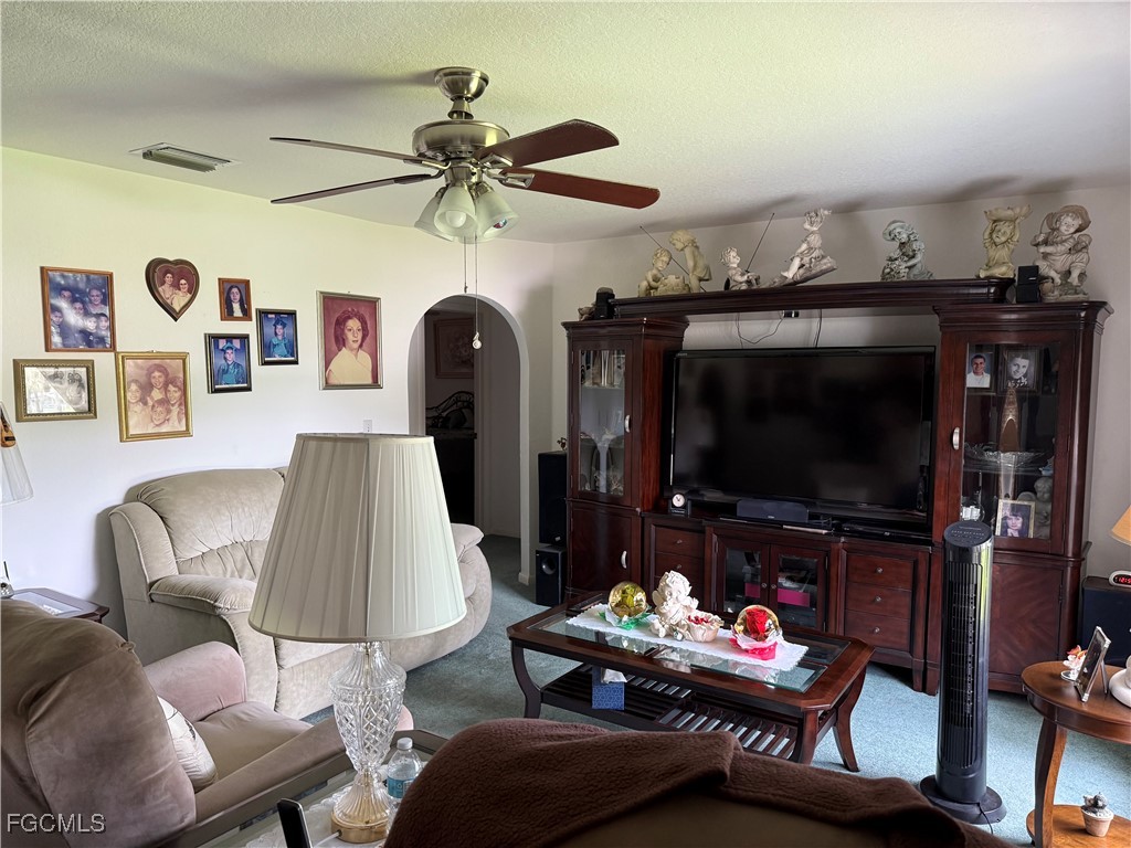 2260 Thompson Road Alva, FL 33920 - Photo 5 of 13 a living room with furniture and a flat screen tv