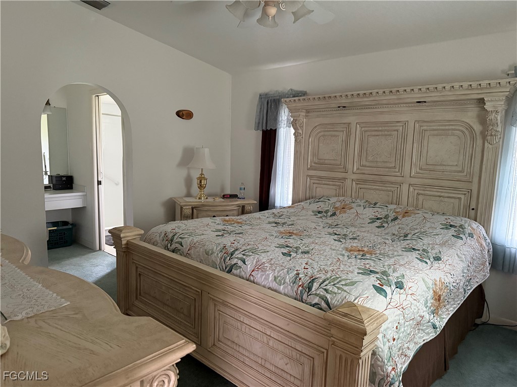 2260 Thompson Road Alva, FL 33920 - Photo 8 of 13 a bedroom with a bed and a sink