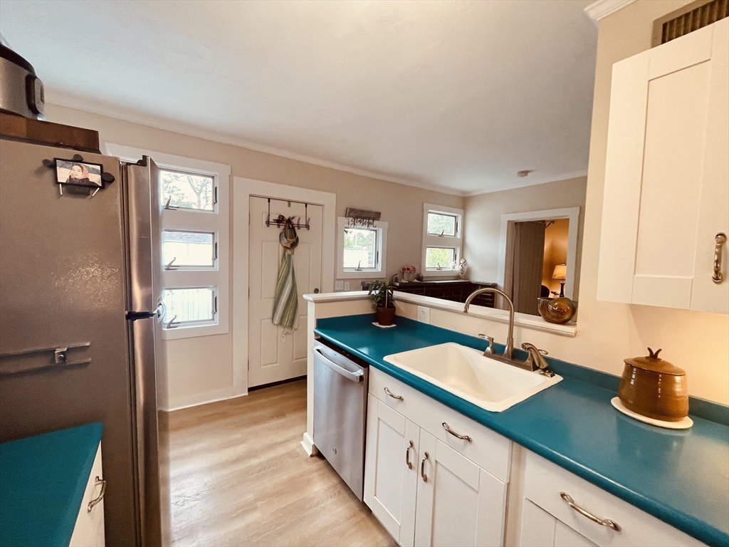 41 Cohasset Road Buzzards Bay, MA 02532 - Photo 5 of 30 a kitchen with sink refrigerator and window