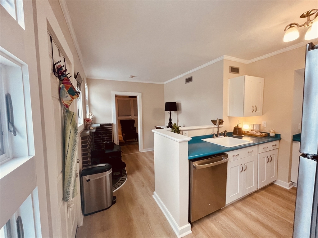 41 Cohasset Road Buzzards Bay, MA 02532 - Photo 8 of 30 a kitchen with stainless steel appliances granite countertop a sink stove and refrigerator