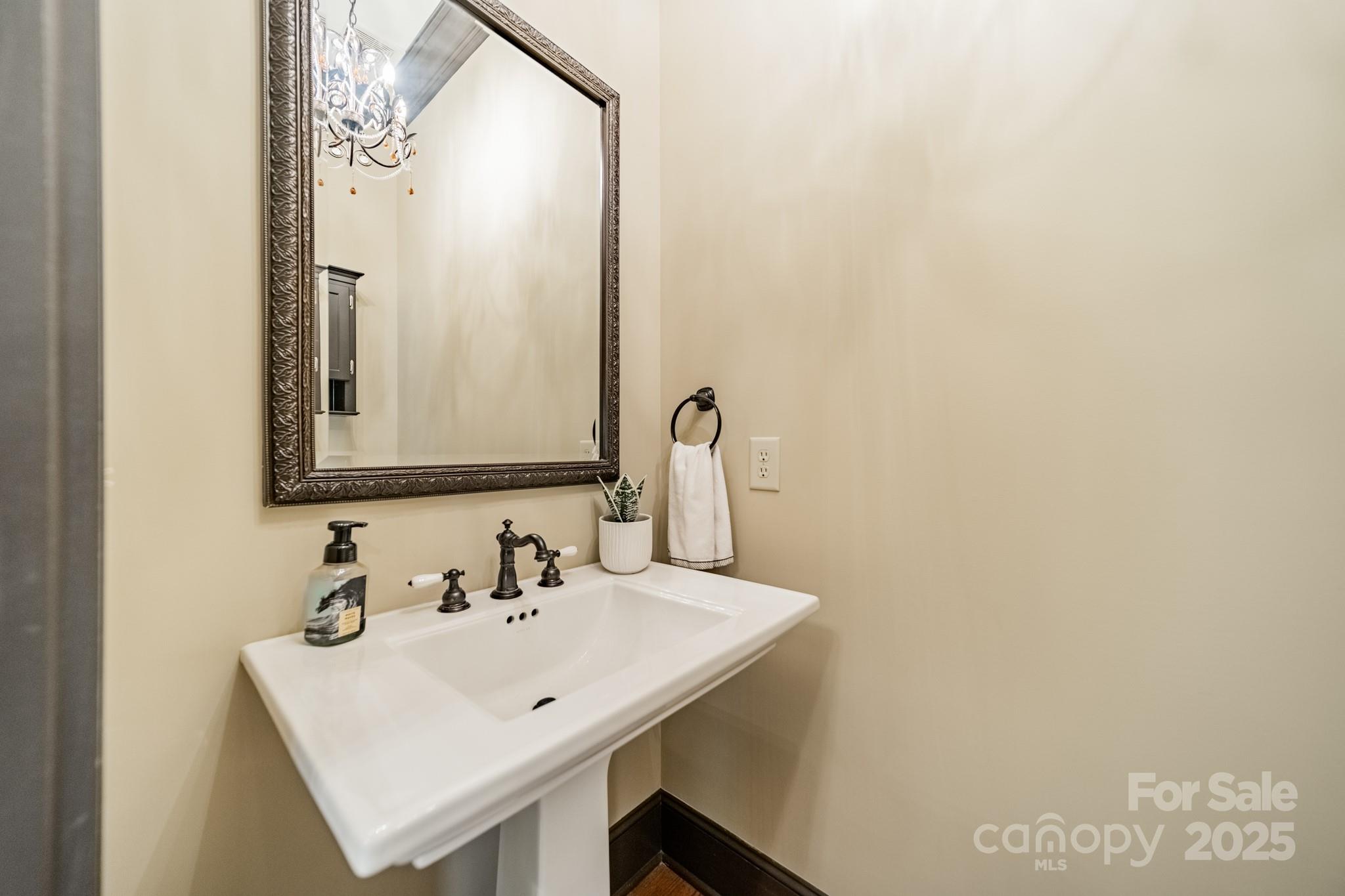 406 Bull Finch Bend Fort Mill, SC 29708 - Photo 11 of 48 a bathroom with a sink a mirror and a vanity