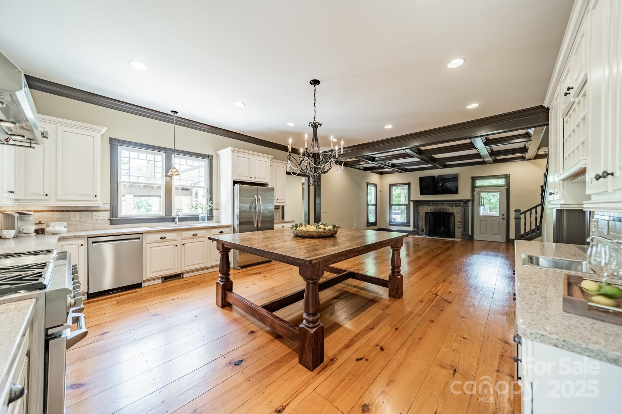 406 Bull Finch Bend Fort Mill, SC 29708 - Photo 15 of 48 a view of a kitchen with furniture and wooden floor