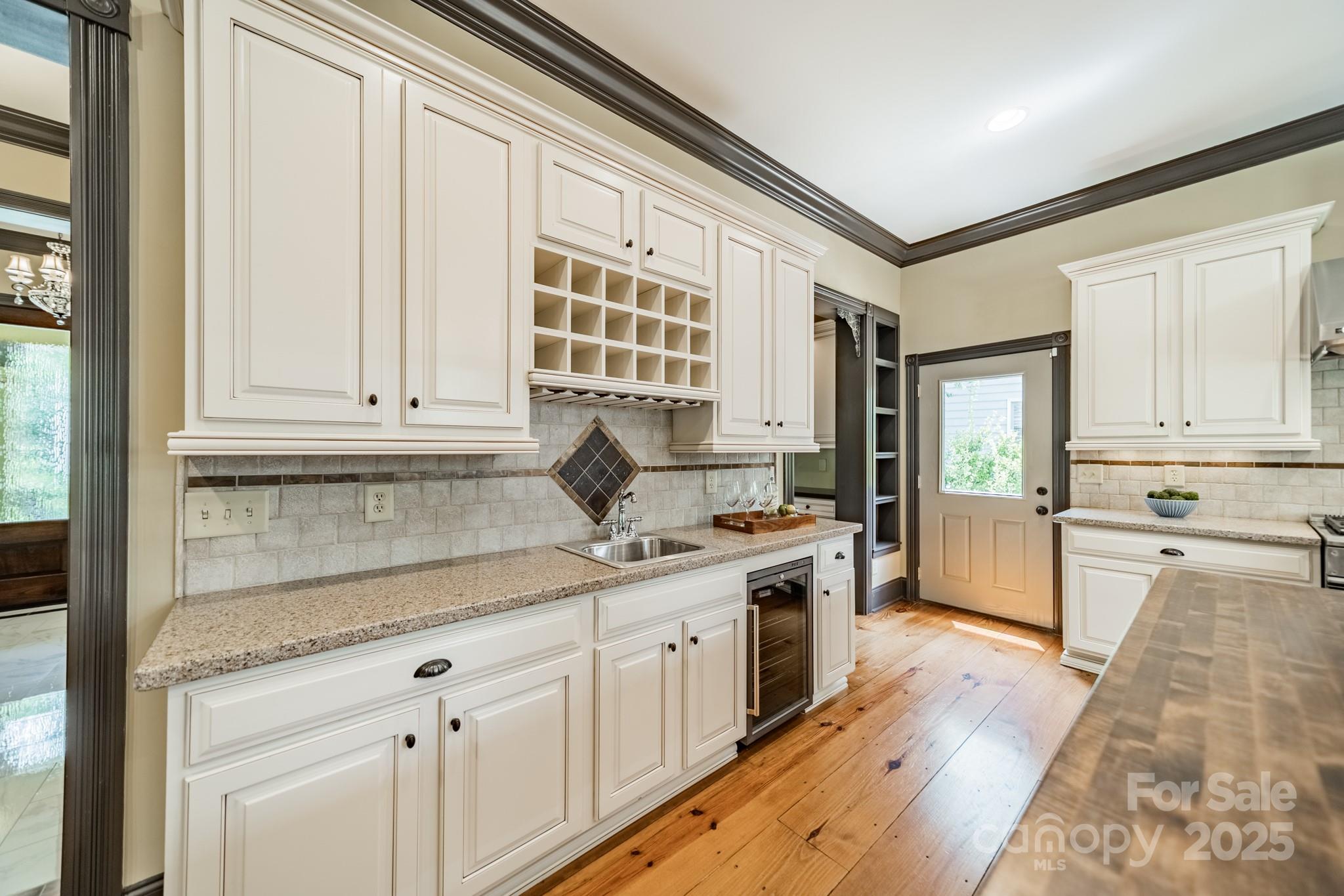 406 Bull Finch Bend Fort Mill, SC 29708 - Photo 16 of 48 a kitchen with a sink stove and cabinets