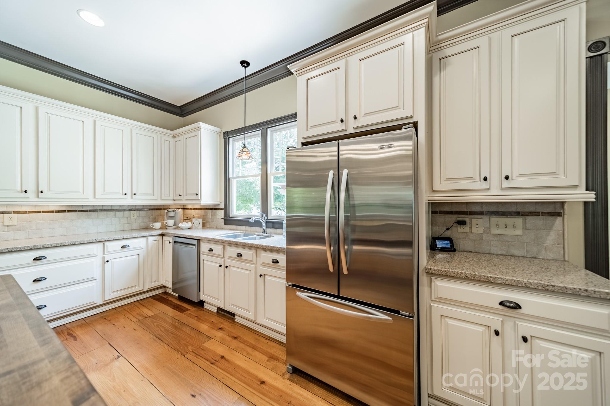 406 Bull Finch Bend Fort Mill, SC 29708 - Photo 17 of 48 a kitchen with granite countertop stainless steel appliances and cabinets