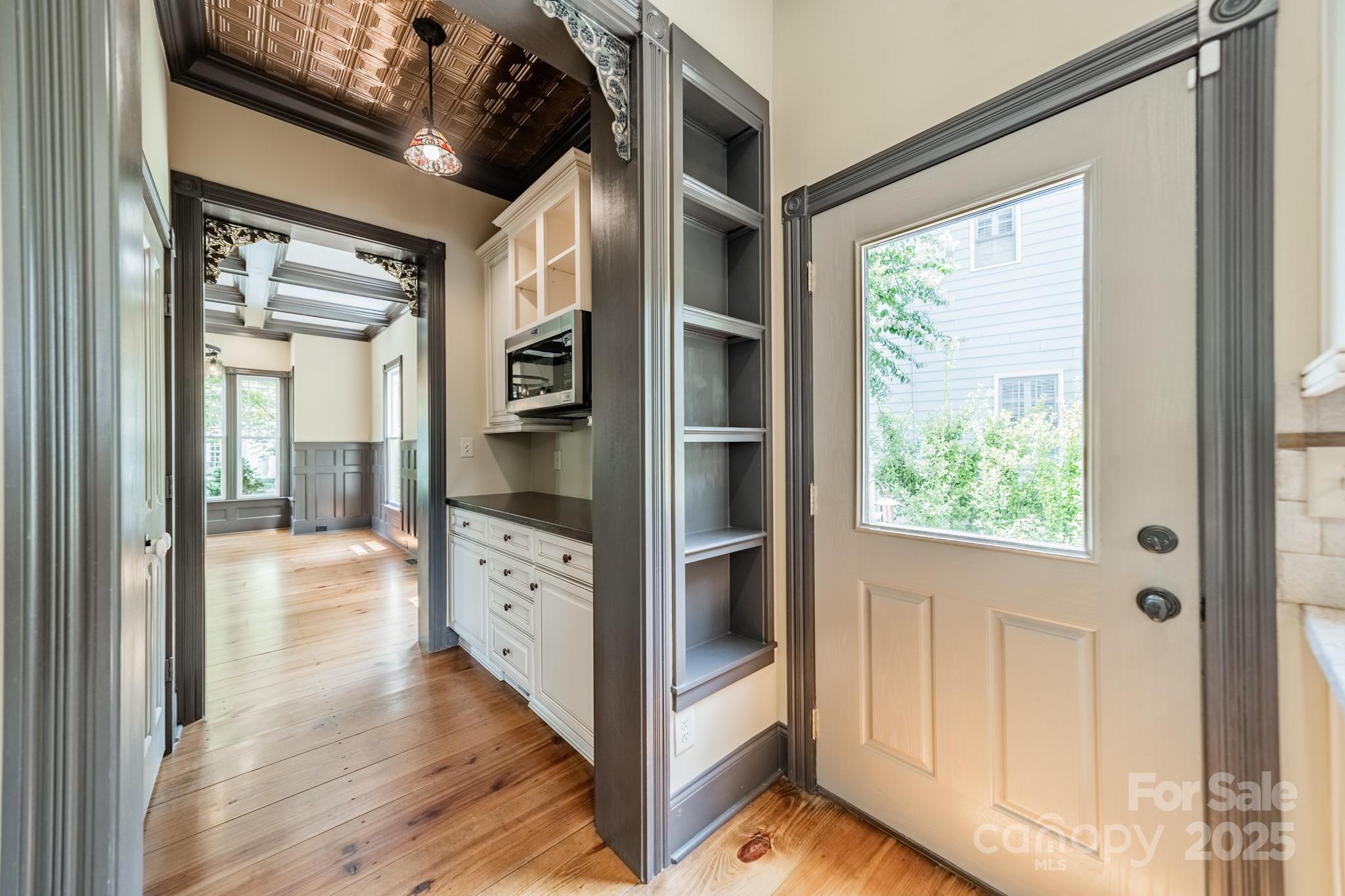 406 Bull Finch Bend Fort Mill, SC 29708 - Photo 19 of 48 a hallway with white doors wooden floor and front door