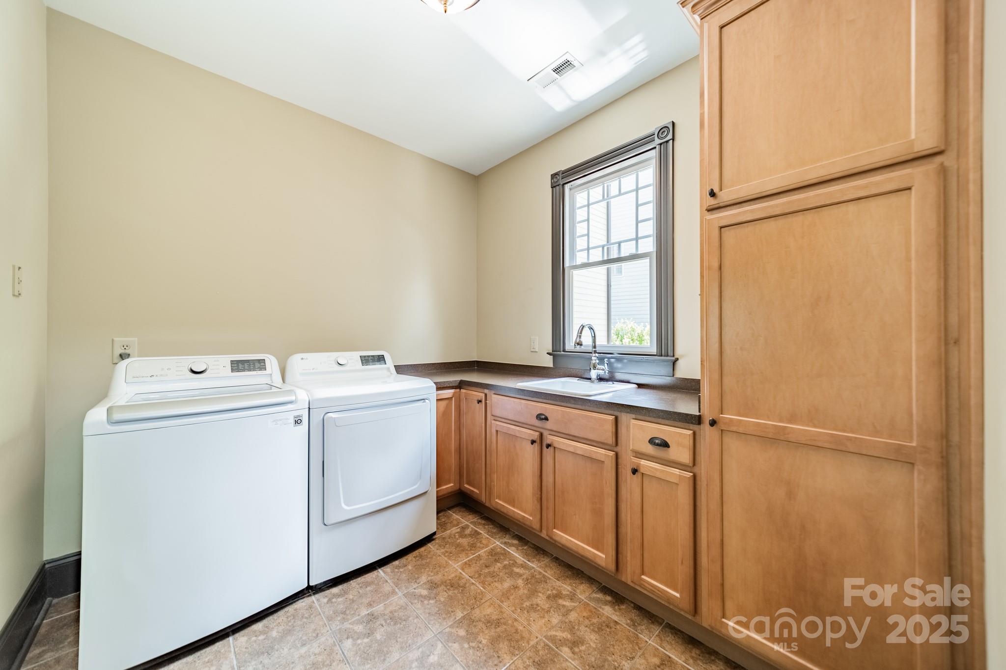 406 Bull Finch Bend Fort Mill, SC 29708 - Photo 21 of 48 a utility room with dryer and washer
