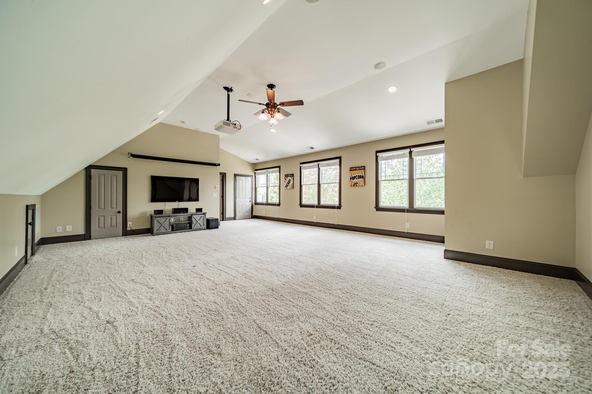 406 Bull Finch Bend Fort Mill, SC 29708 - Photo 23 of 48 a view of empty room with a fireplace and windows