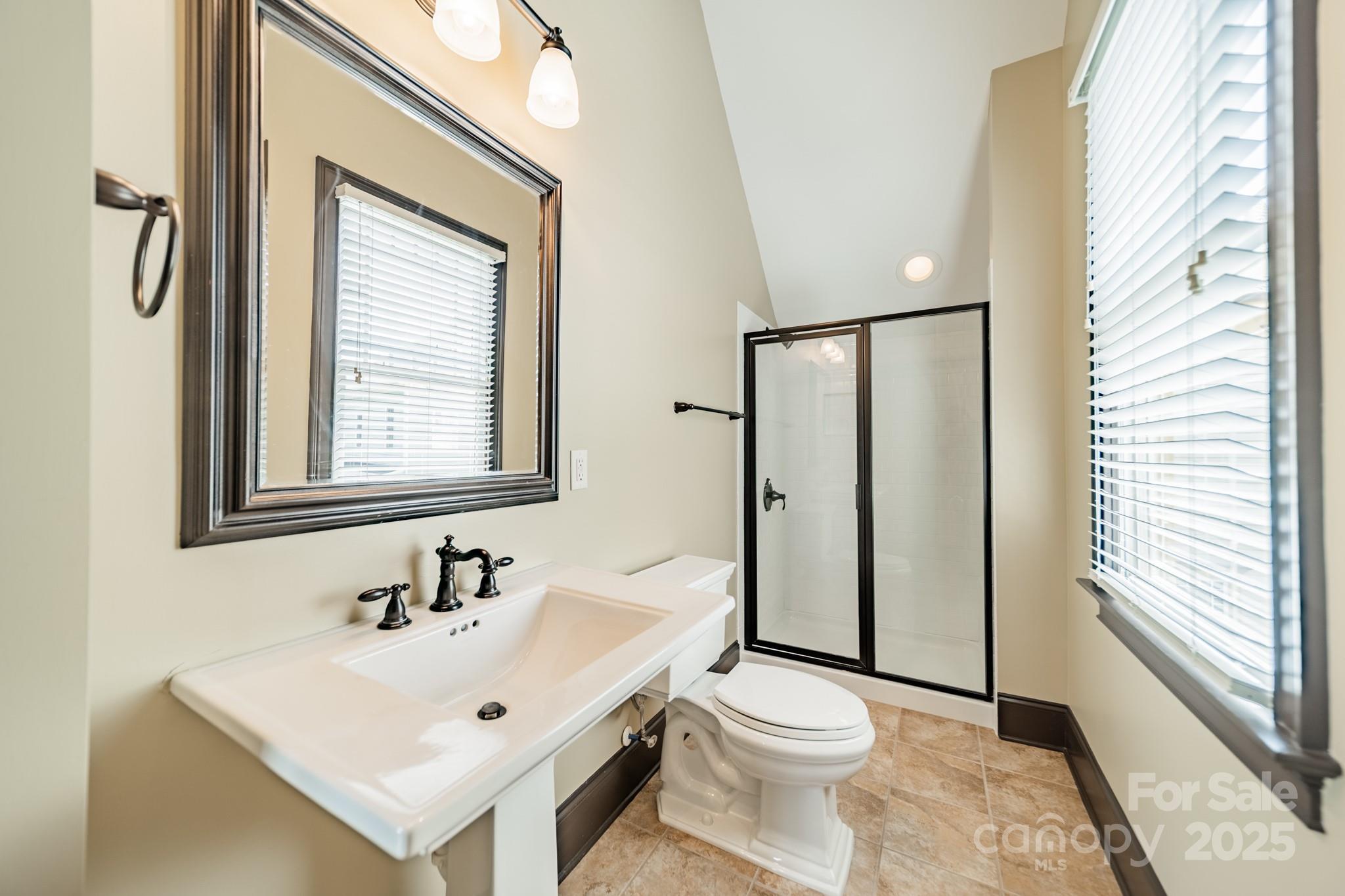 406 Bull Finch Bend Fort Mill, SC 29708 - Photo 24 of 48 a bathroom with a sink toilet and mirror