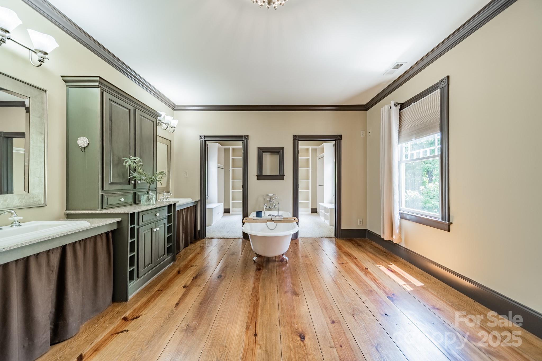 406 Bull Finch Bend Fort Mill, SC 29708 - Photo 28 of 48 a spacious bathroom with a double vanity sink and a large mirror
