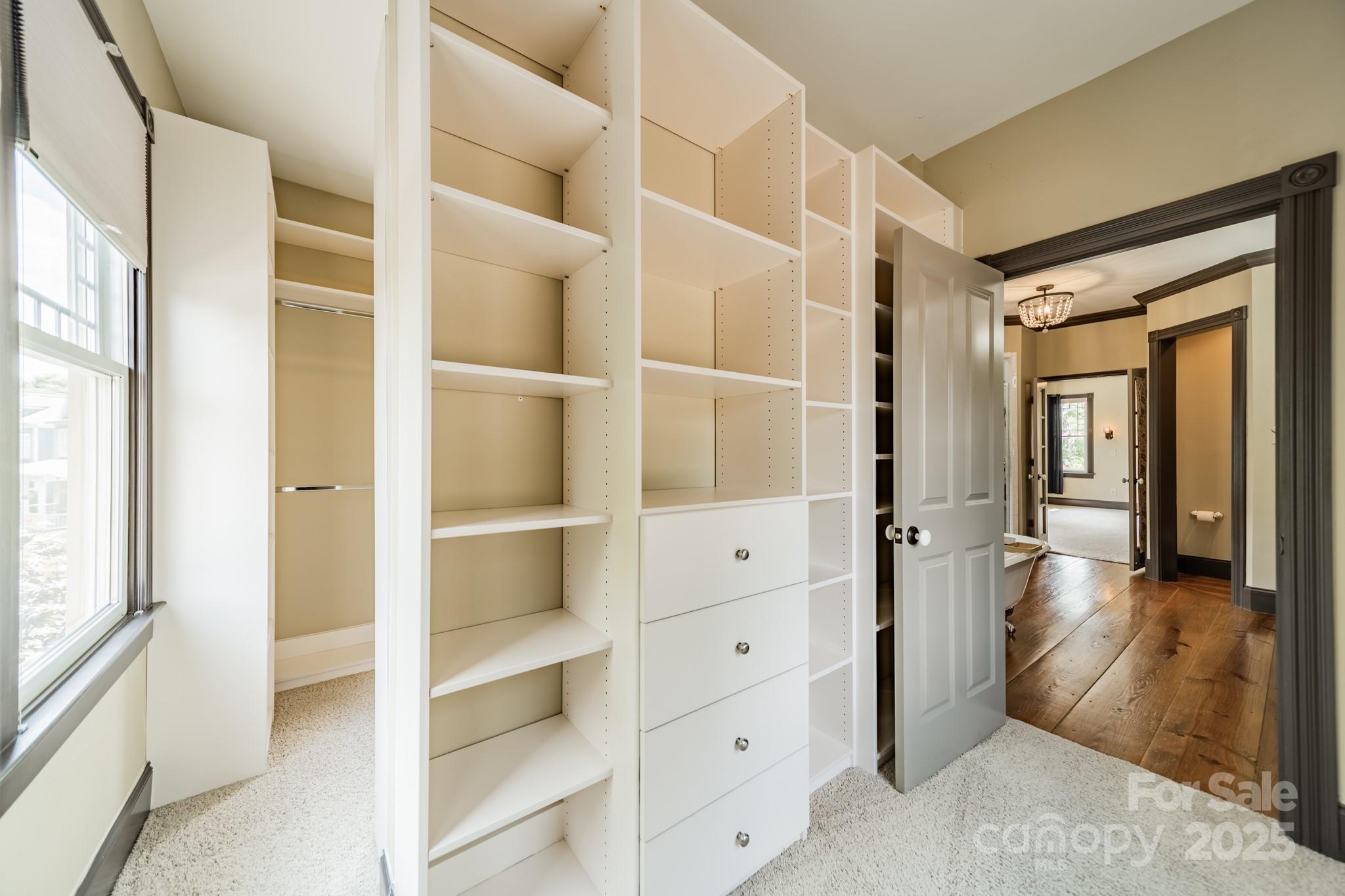 406 Bull Finch Bend Fort Mill, SC 29708 - Photo 30 of 48 a view of walk in closet with empty racks