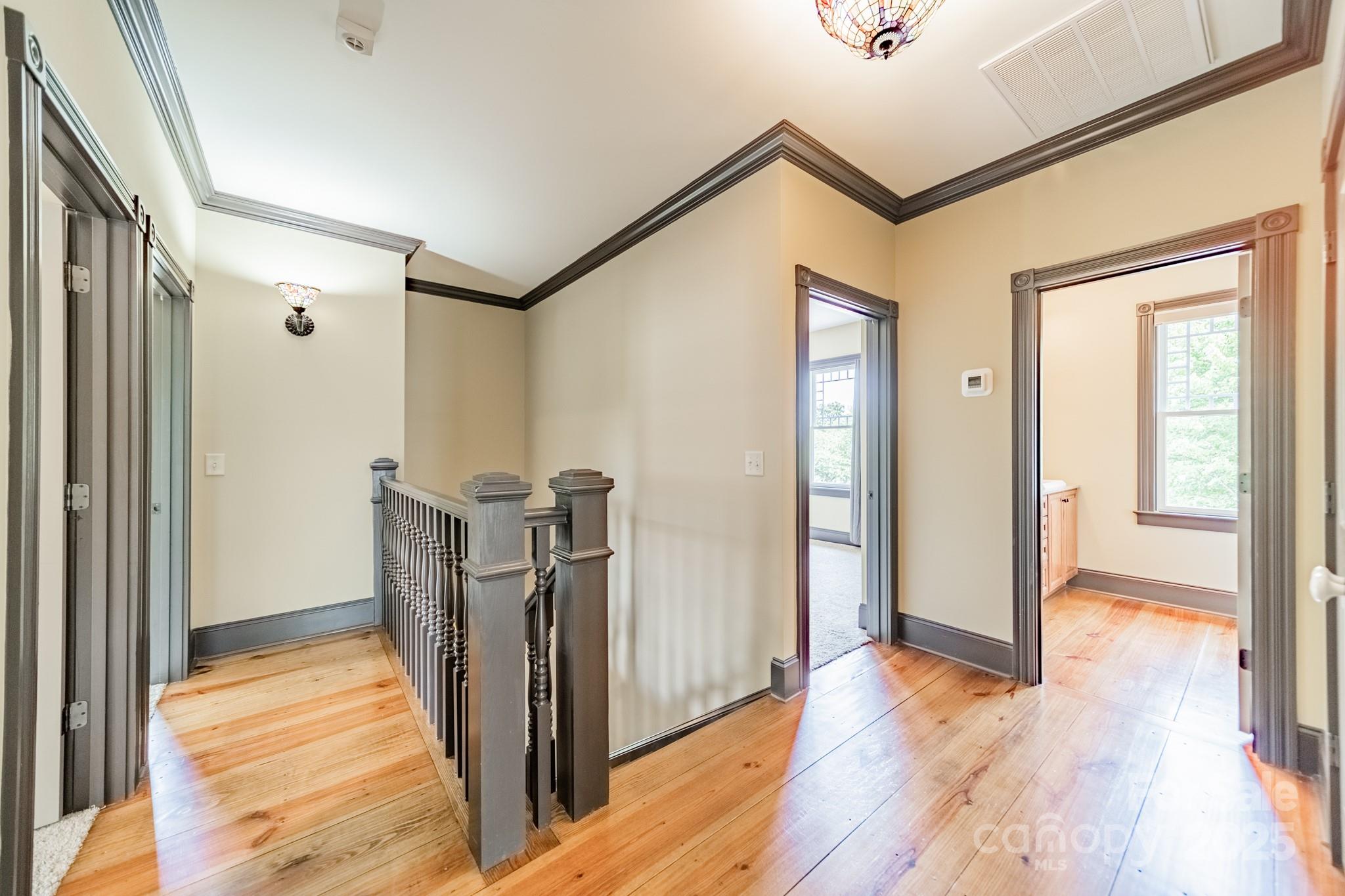 406 Bull Finch Bend Fort Mill, SC 29708 - Photo 34 of 48 a view of a hallway with wooden floor and closet area