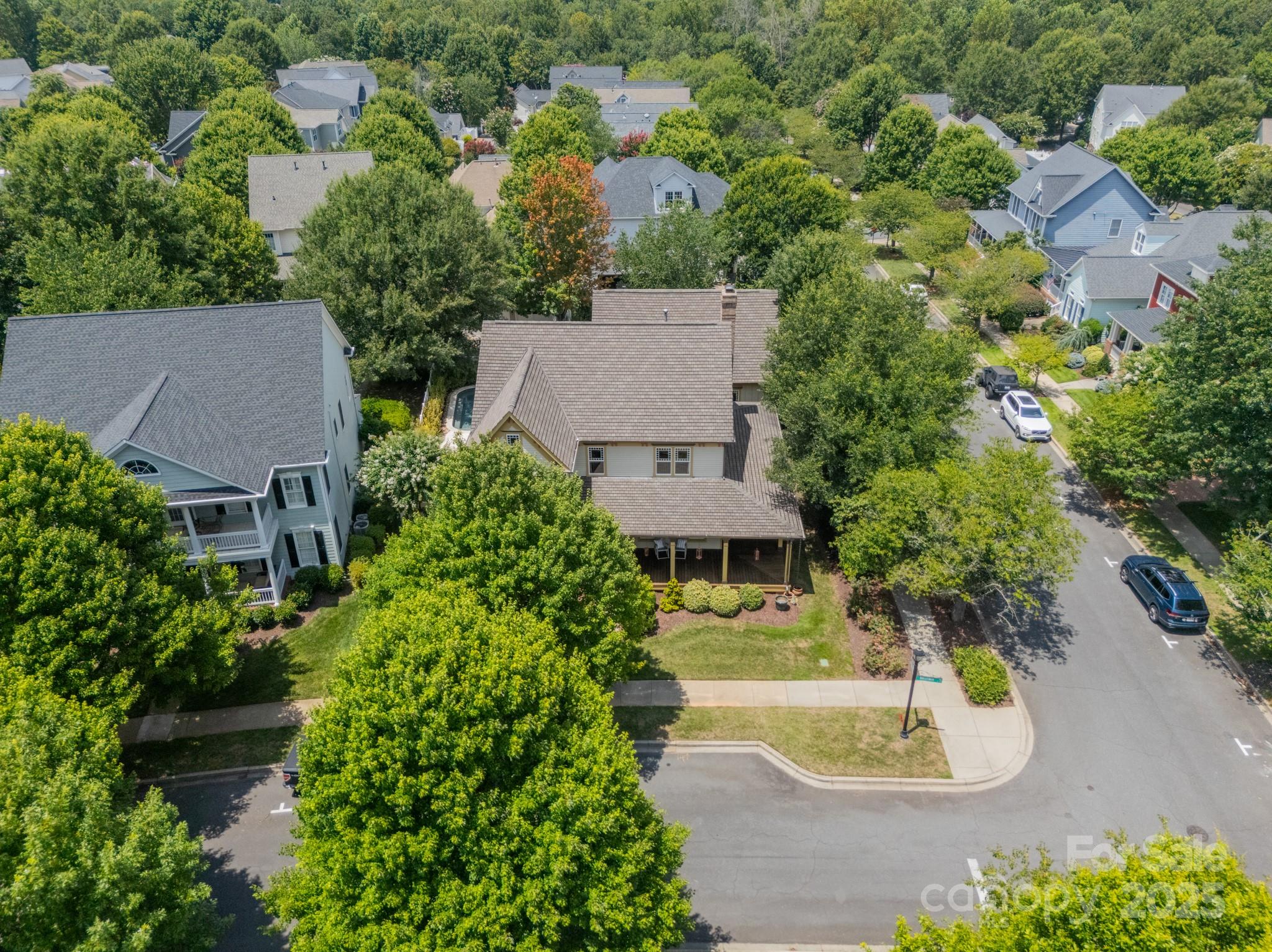 406 Bull Finch Bend Fort Mill, SC 29708 - Photo 44 of 48 an aerial view of a house with a garden and swimming pool