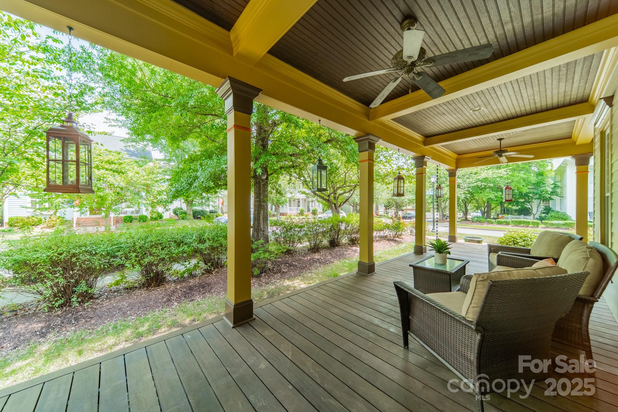 406 Bull Finch Bend Fort Mill, SC 29708 - Photo 6 of 48 a living room with patio furniture and a floor to ceiling window