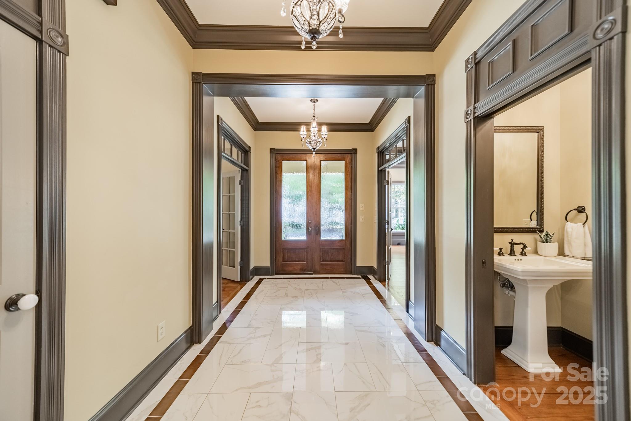 406 Bull Finch Bend Fort Mill, SC 29708 - Photo 9 of 48 a view of a hallway with furniture and a chandelier