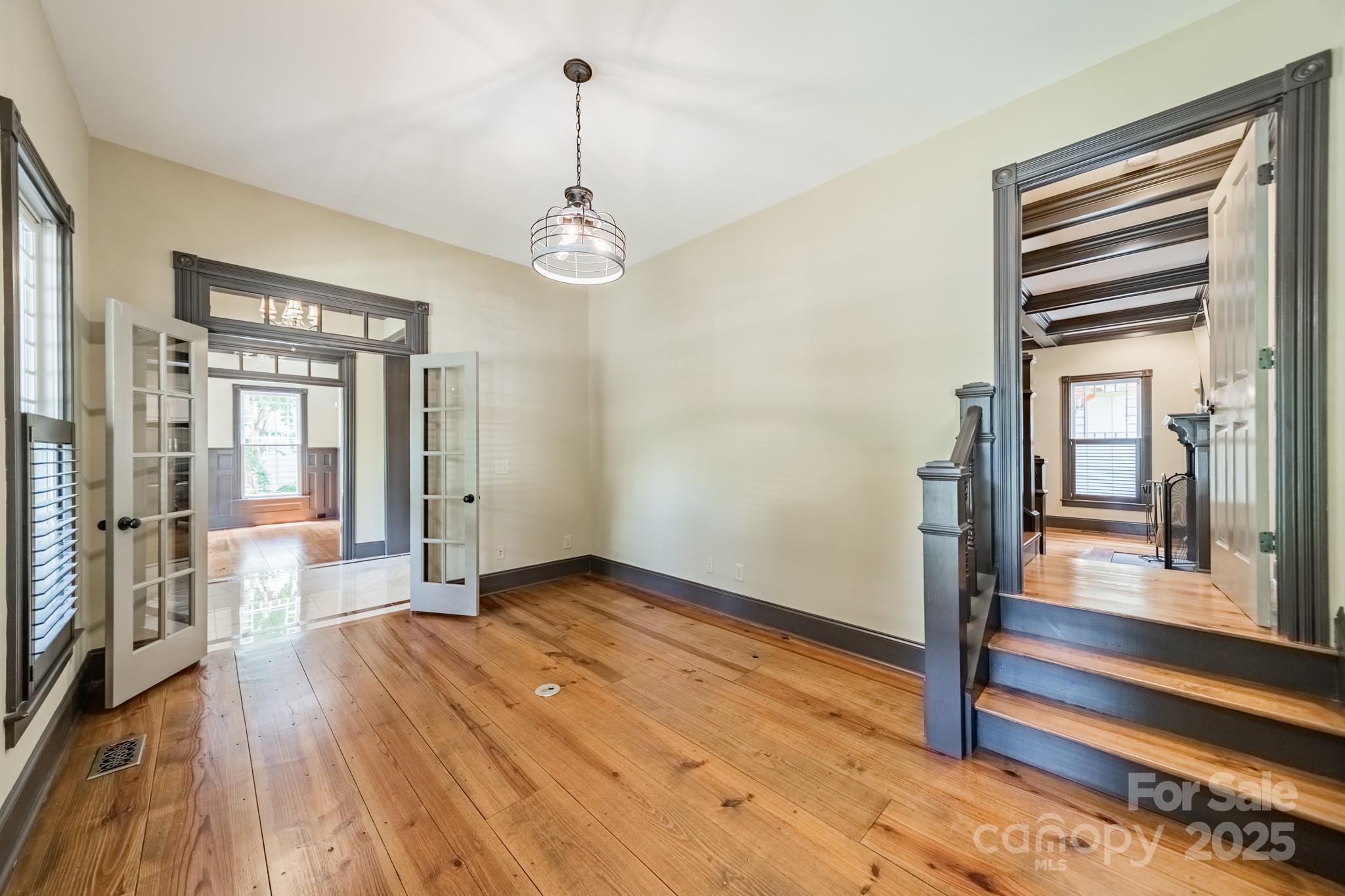 406 Bull Finch Bend Fort Mill, SC 29708 - Photo 10 of 48 a view of a room with wooden floor and stairs