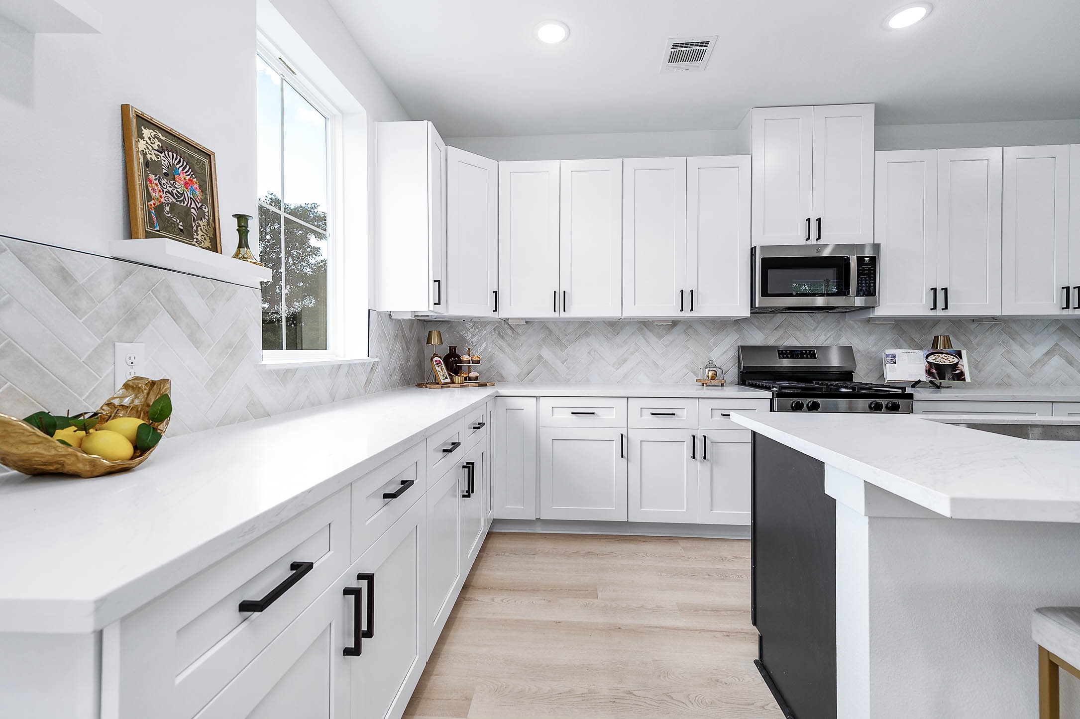 1515 Euel Street Houston, TX 77009 - Photo 13 of 34 Bright and spacious kitchen layout featuring abundant counter space, crisp cabinetry, and a welcoming design for everyday living.