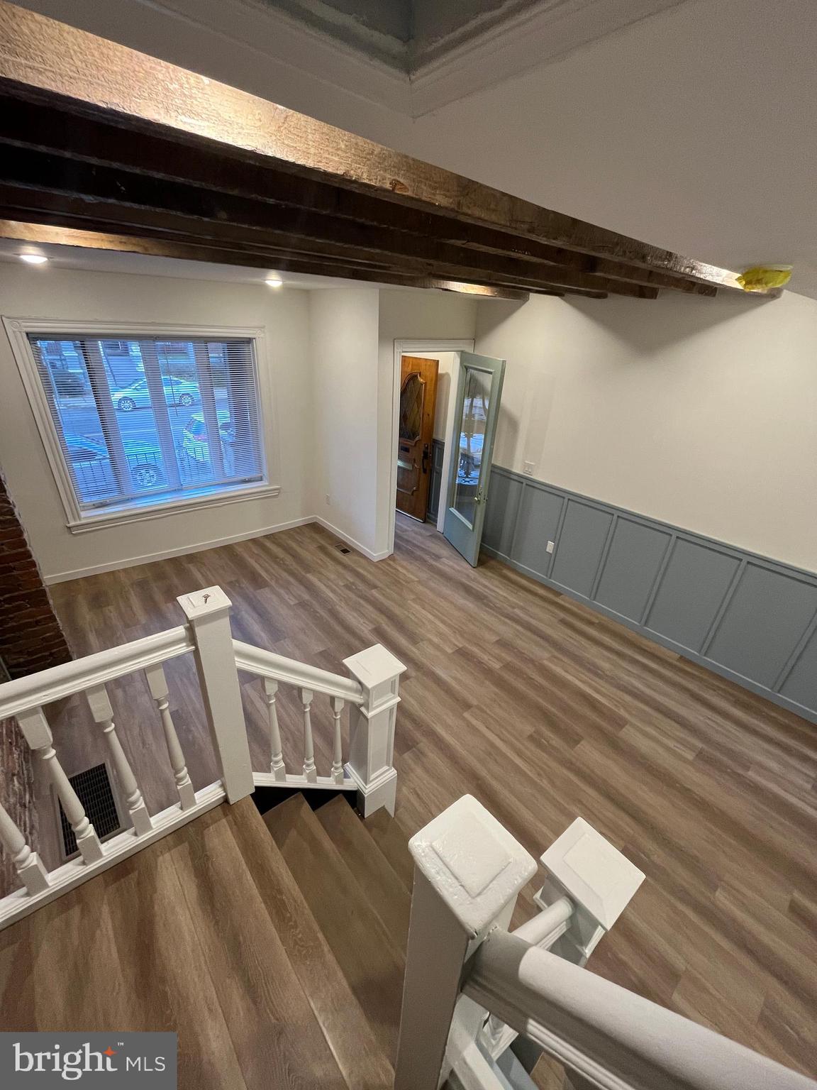 5712 Cedar Avenue Philadelphia, PA 19143 - Photo 11 of 56 a view of an empty room with wooden floor