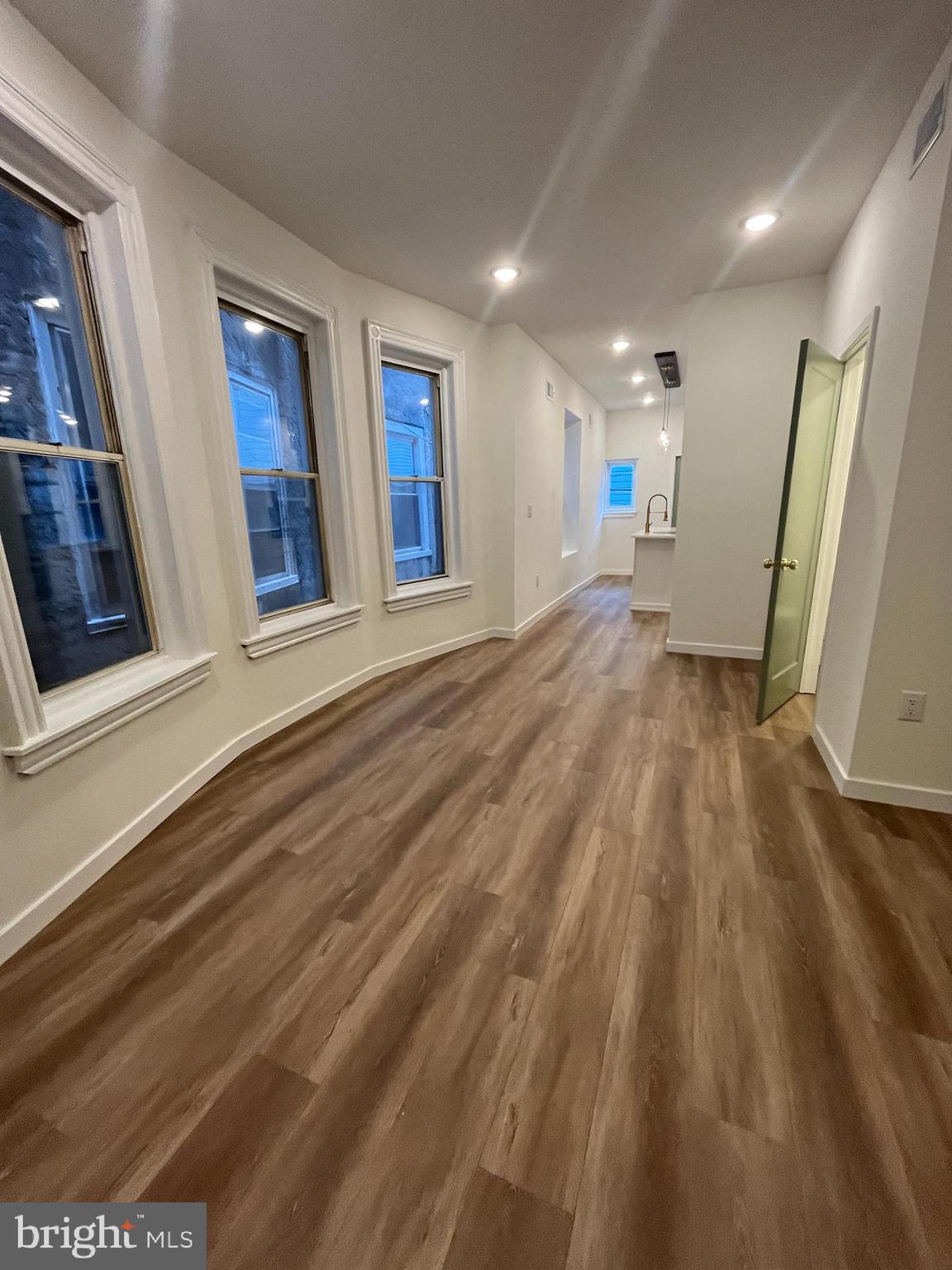 5712 Cedar Avenue Philadelphia, PA 19143 - Photo 15 of 56 a view of livingroom with hardwood floor and front door