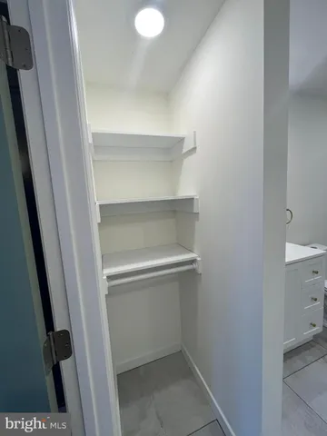 a view of livingroom with hallway and closet