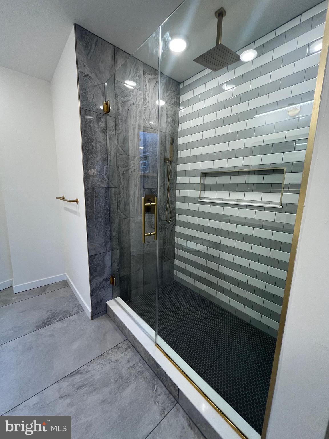 5712 Cedar Avenue Philadelphia, PA 19143 - Photo 25 of 56 a bathroom with a shower and a sink