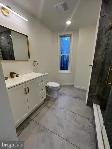 a bathroom with a sink and a shower