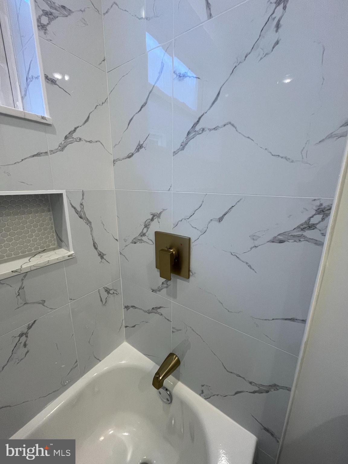 5712 Cedar Avenue Philadelphia, PA 19143 - Photo 30 of 56 a bathroom with a sink and a shower