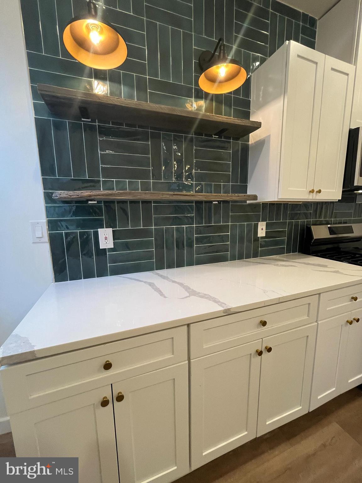 5712 Cedar Avenue Philadelphia, PA 19143 - Photo 3 of 56 a kitchen with a sink and cabinets