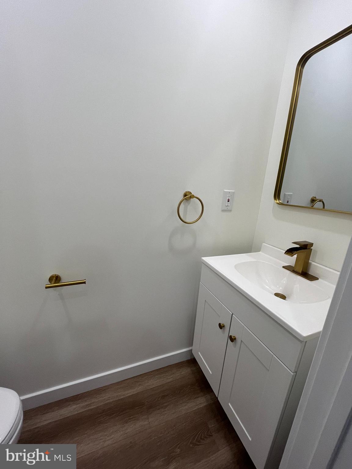 5712 Cedar Avenue Philadelphia, PA 19143 - Photo 33 of 56 a bathroom with a sink and a mirror