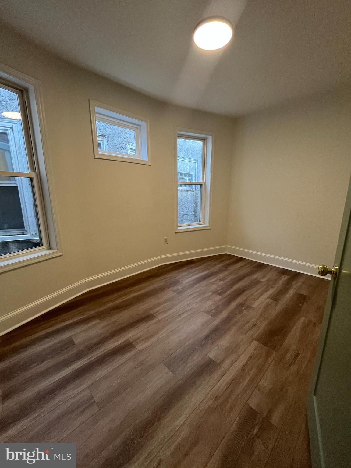 5712 Cedar Avenue Philadelphia, PA 19143 - Photo 35 of 56 a view of room with window and hardwood floor
