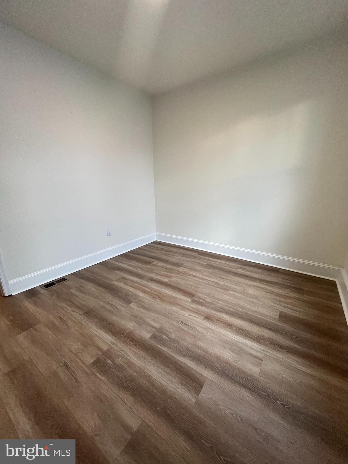 5712 Cedar Avenue Philadelphia, PA 19143 - Photo 36 of 56 an empty room with wooden floor