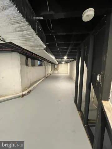 a view of a patio with a table and chairs