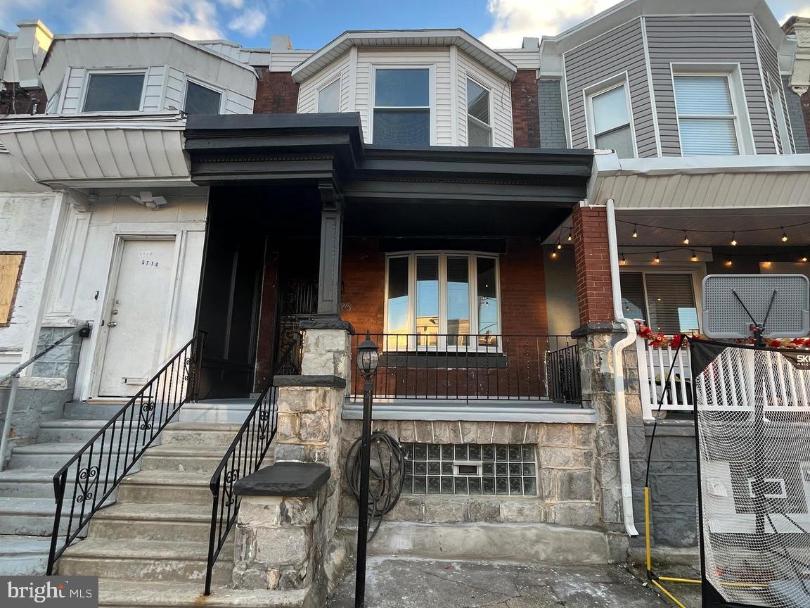 5712 Cedar Avenue Philadelphia, PA 19143 - Photo 55 of 56 a front view of a house with a large windows